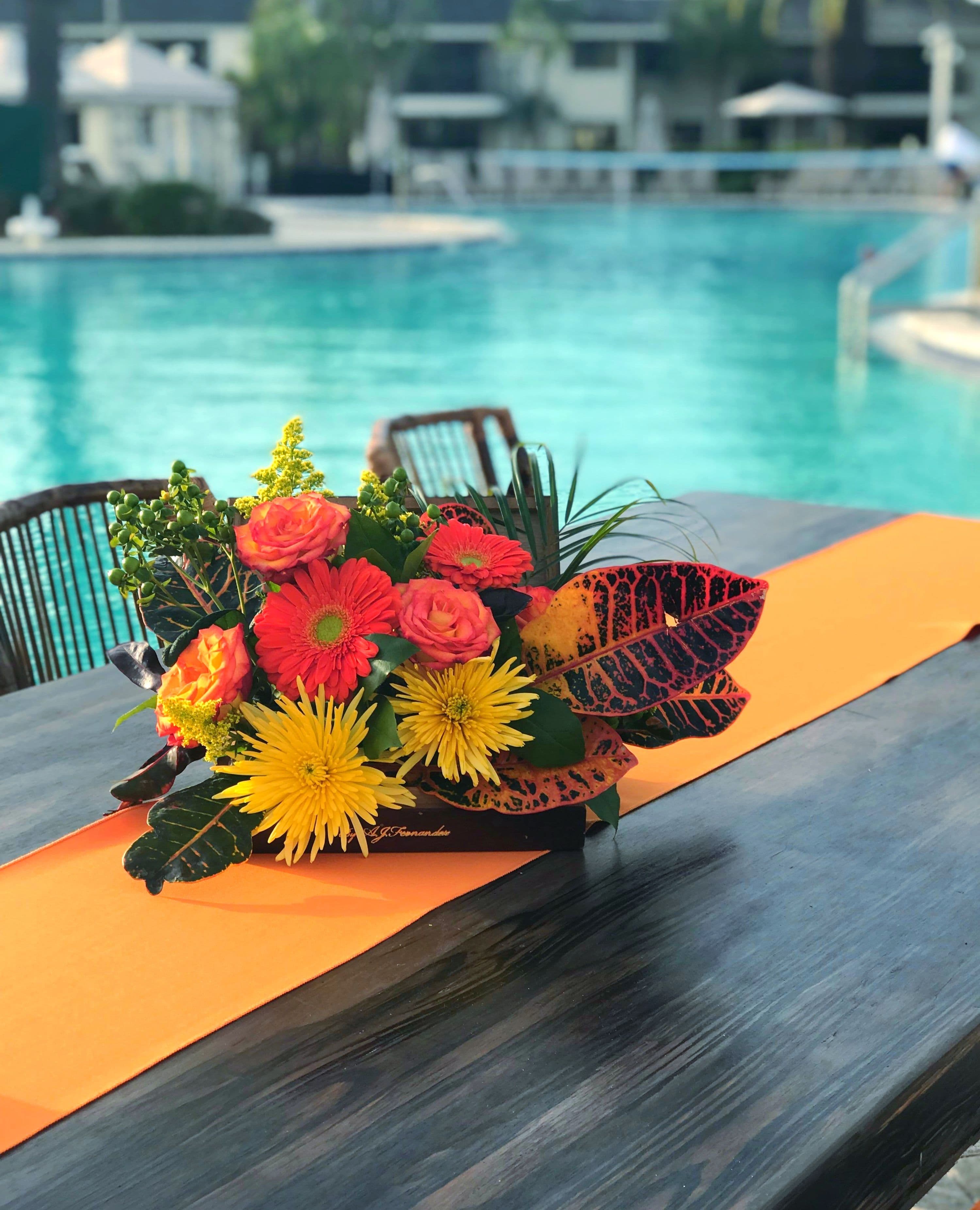 Tropical Floral Centerpiece | Tropical centerpieces, Poolside decor ...